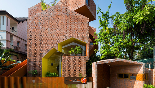 A Modern Educational Environment with Bare Brick Forming Patterns and Openings.